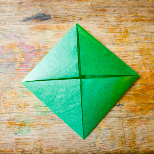 Fold each corner in to make a triangle