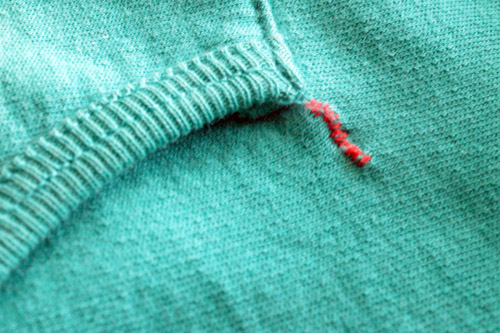 mend a separated pocket with a whip stitch