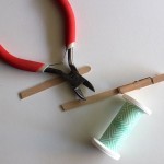 Make a DIY picture holder from a spent spool of thread!