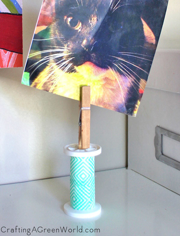Make a DIY picture holder from a spent spool of thread!