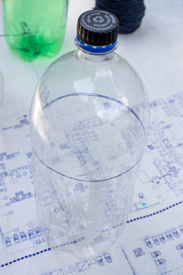 Measure and cut the bottom off the bottle.