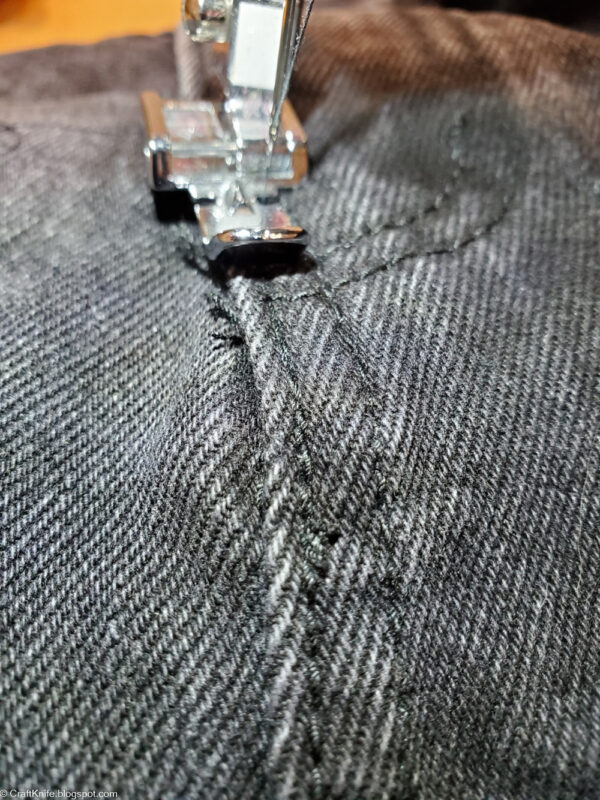 Re-sew the stitching at the fly