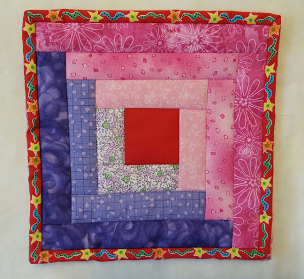 quilt-as-you-go log cabin hot pad via My Patchwork Quilt
